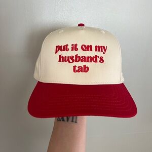 Put It On My Husband’s Tab Trucker Hat
